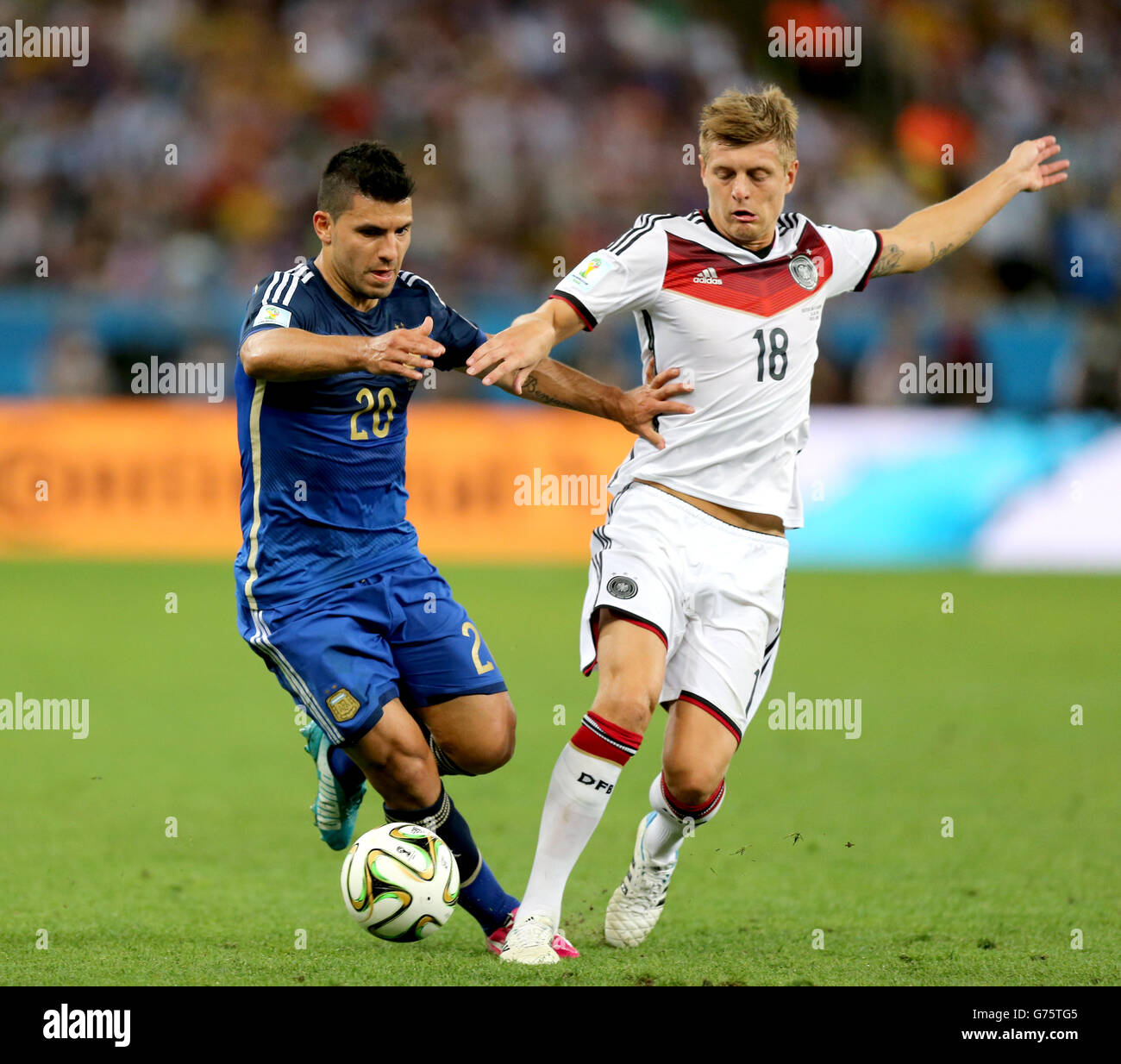 Germany's Toni Kroos (right) and Argentina's Sergio Aguero battle for the ball Stock Photo