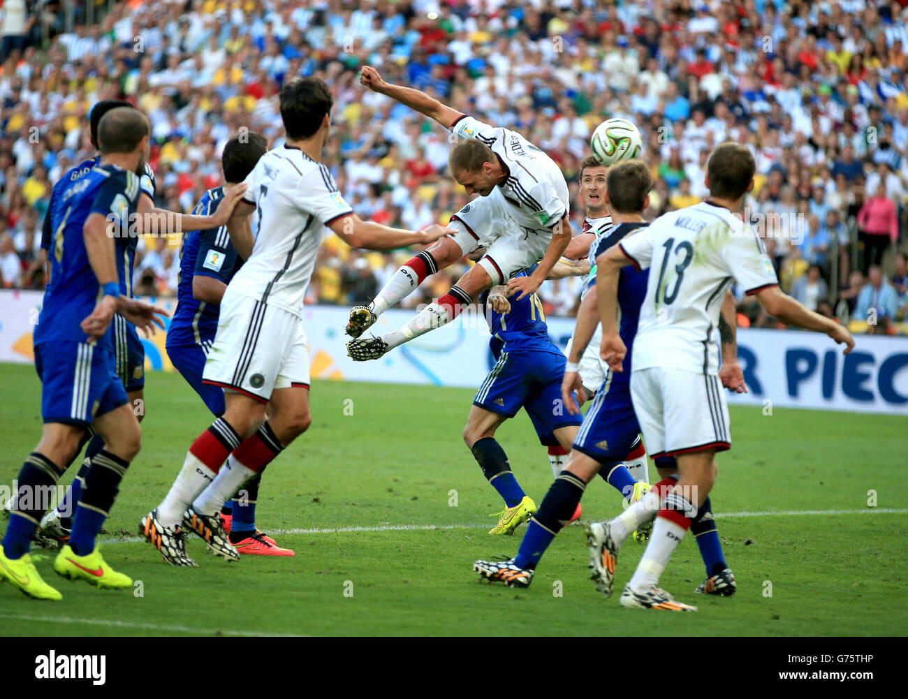 Soccer - FIFA World Cup 2014 - Final - Germany v Argentina - Estadio do Maracana. Action in the box as Germany's Benedikt Howedes has a header on target Stock Photo