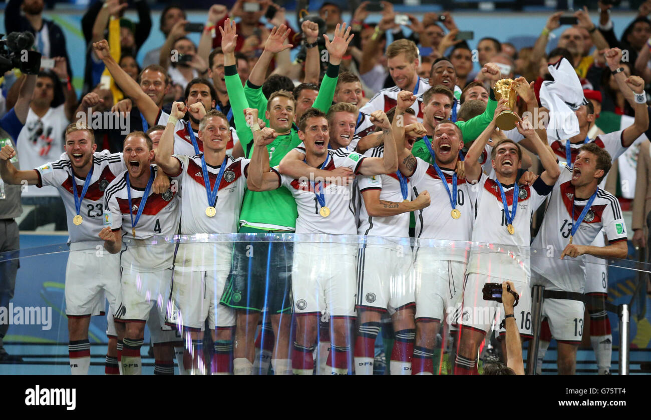 RIO DE JANEIRO, BRAZIL - JULY 13: Philipp Lahm of Germany lifts the World  Cup trophy to celebrate with his team…