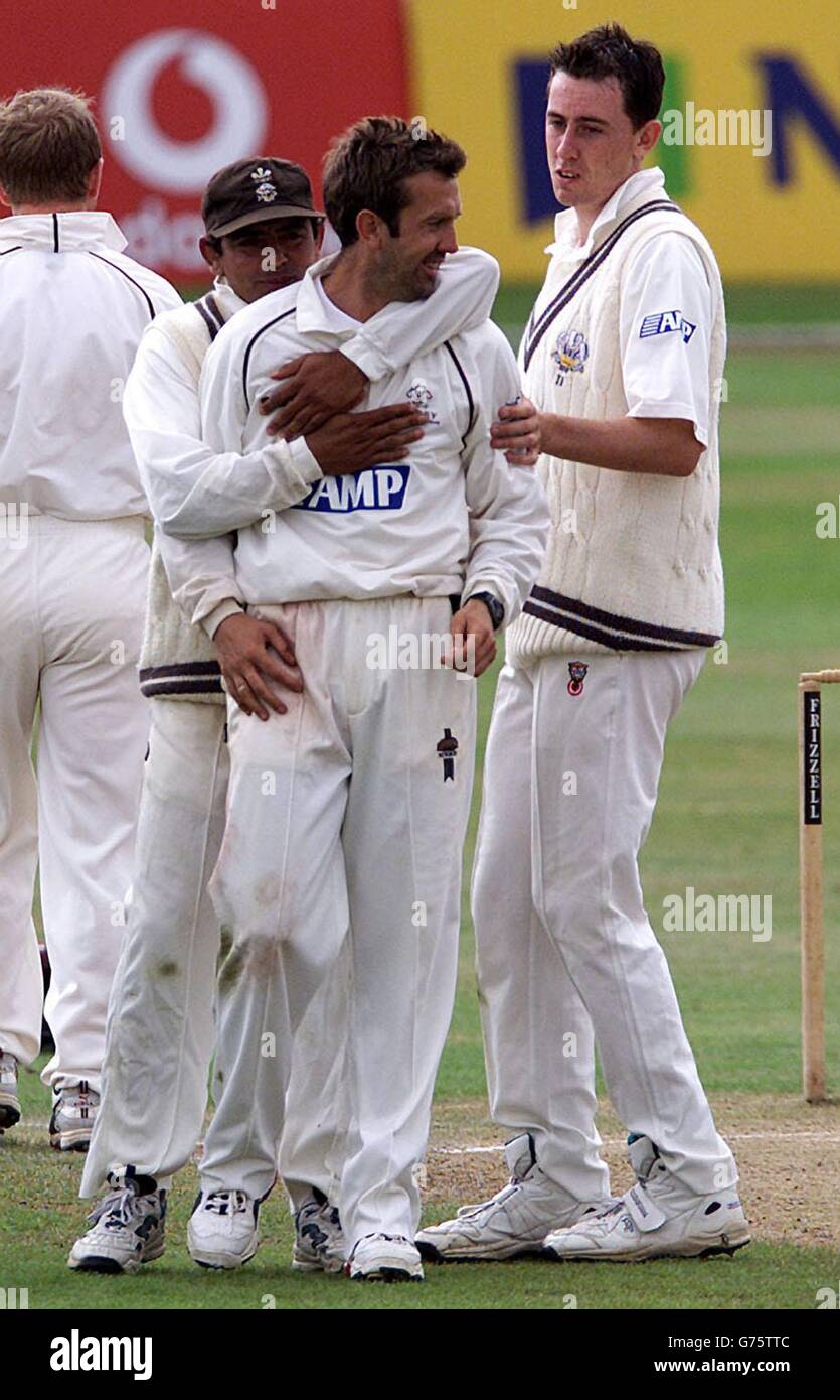 Surrey bowler Ian Salisbury (centre) celebrates with Saqlain Mushtaq (left) Rikki Clarke (right) after Warwickshire's Jim Troughton was called LBW for 63 during the Frizzell County Championship match, on the last day at Edgbaston, Birmingham. Stock Photo