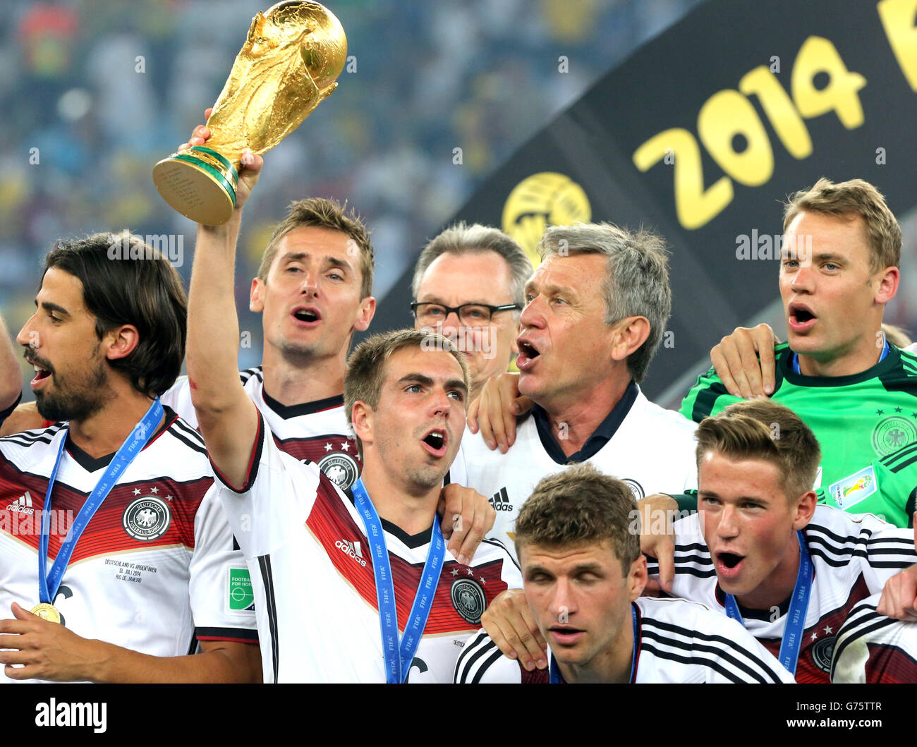 Germany's Philip Lahm celebrates with the FIFA World Cup 2014 Trophy alongside teammates Stock Photo