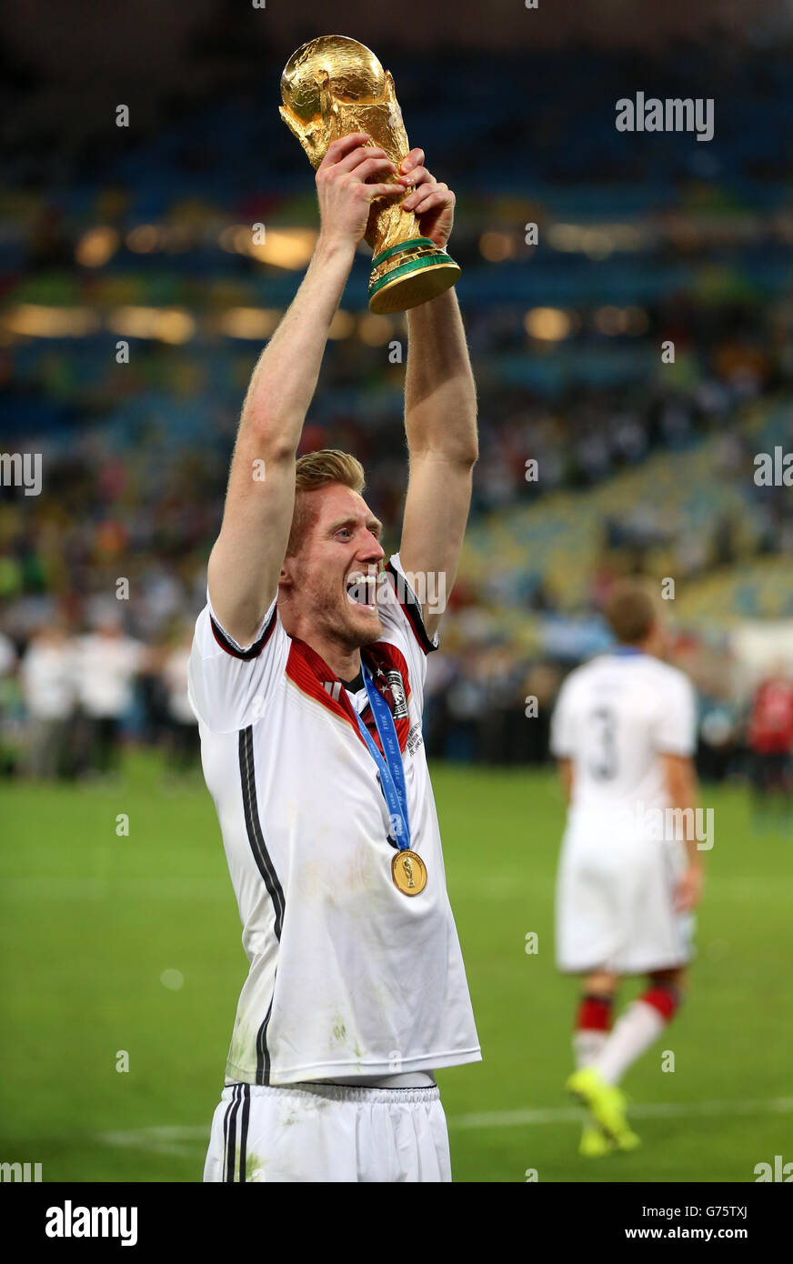 Germany's Andre Schurrle celebrates winning the World Cup after the FIFA World Cup Final at the Estadio do Maracana, Rio de Janerio, Brazil. Stock Photo