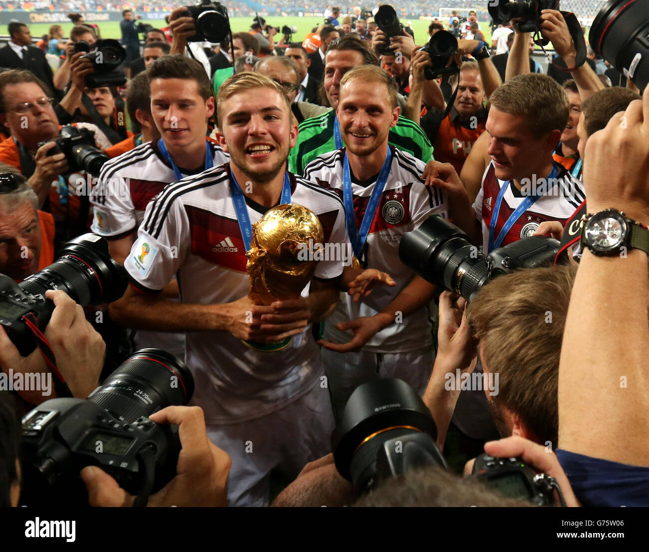 Germany's Christoph Kramer is mobbed by photographers while celebrating winning the FIFA World Cup Final at the Estadio do Maracana, Rio de Janerio, Brazil. Stock Photo