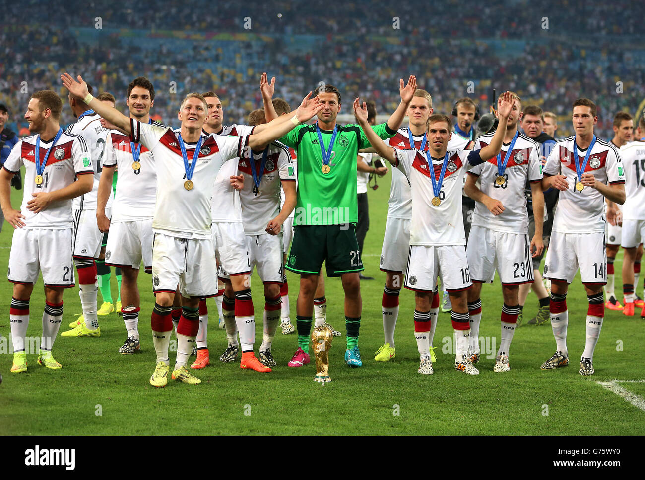 Soccer - FIFA World Cup 2014 - Final - Germany v Argentina - Estadio do Maracana. Germany's Bastian Schweinsteiger (third left) leads the celebrations after victory in the FIFA World Cup Final Stock Photo