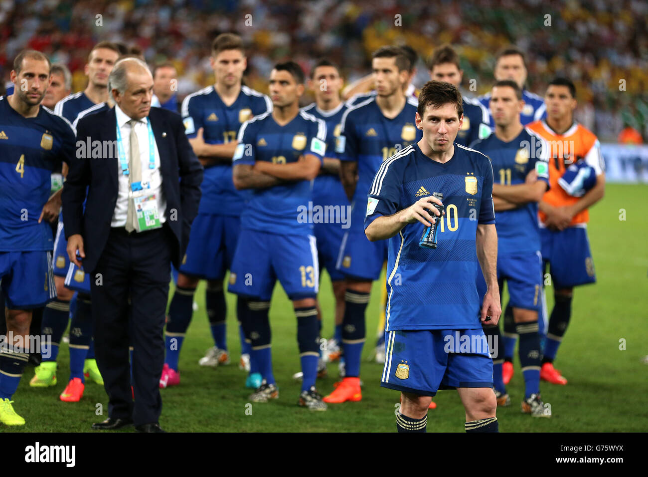 Argentina's Lionel Messi (right) appears dejected after the final whistle of the FIFA World Cup Final at the Estadio do Maracana, Rio de Janerio, Brazil. Stock Photo