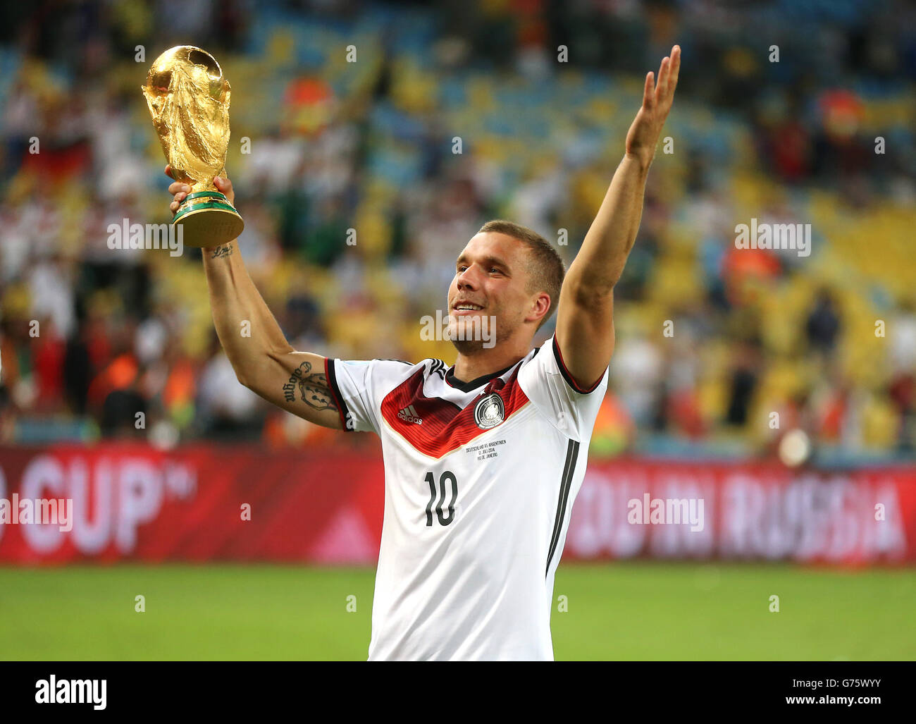 Germany's Lukas Podolski celebrates with the World Cup trophy Stock Photo