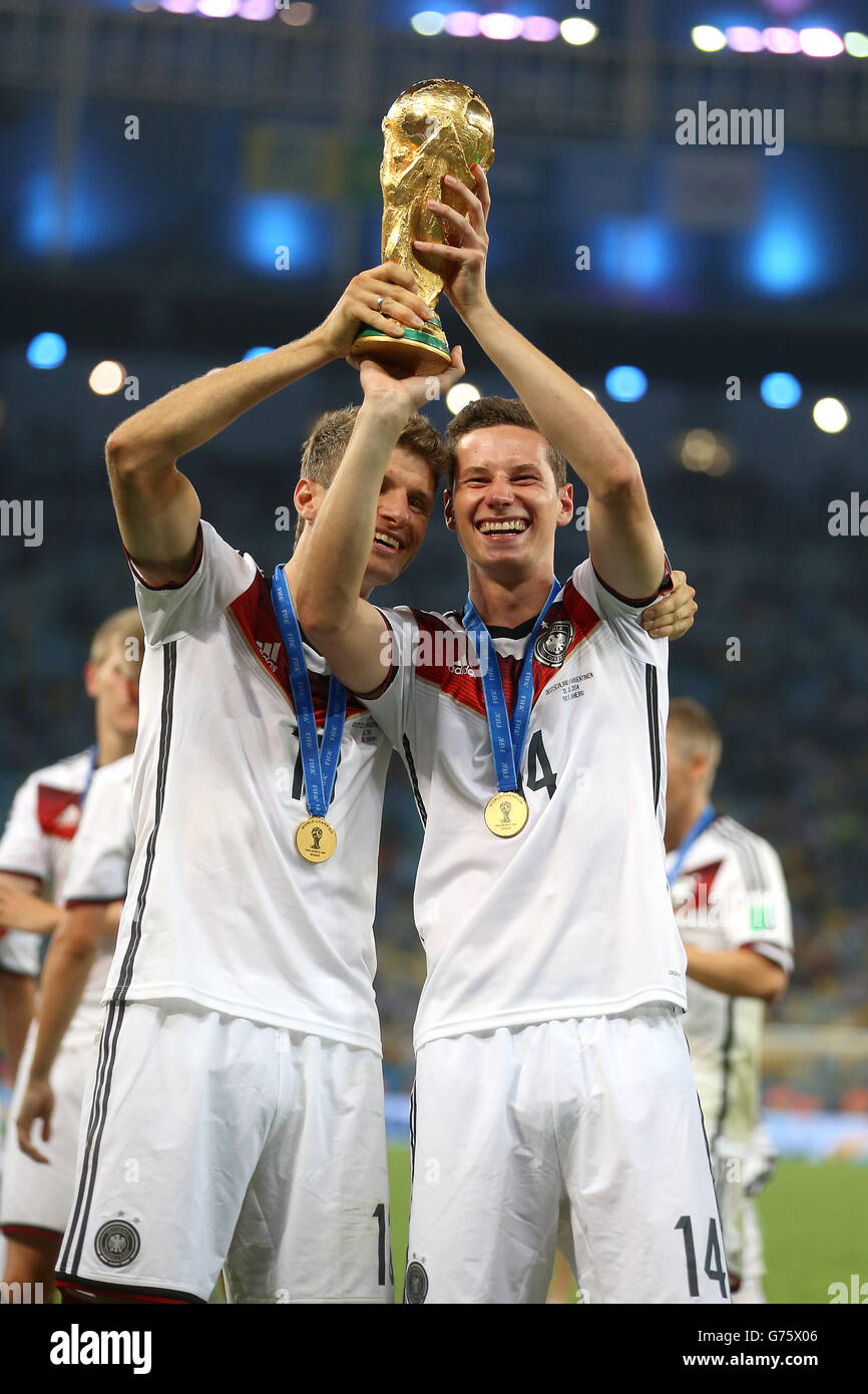 Germany's Thomas Muller and Julian Draxler (right) celebrate victory in the World Cup Final Stock Photo