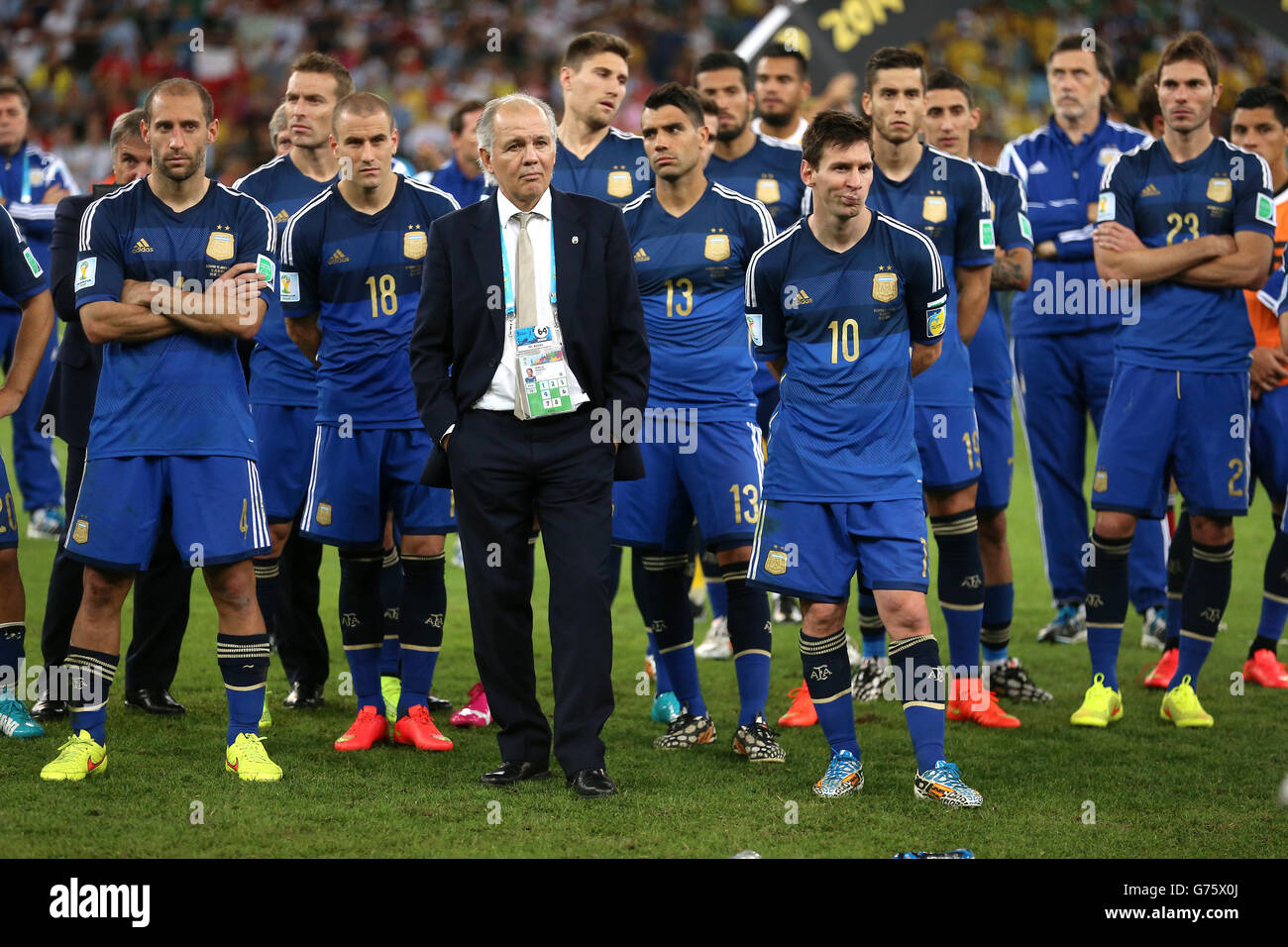 Argentina manager Alenjandro Sabella and Lionel Messi (number 10) appear dejected after the FIFA World Cup Final at the Estadio do Maracana, Rio de Janerio, Brazil. Stock Photo