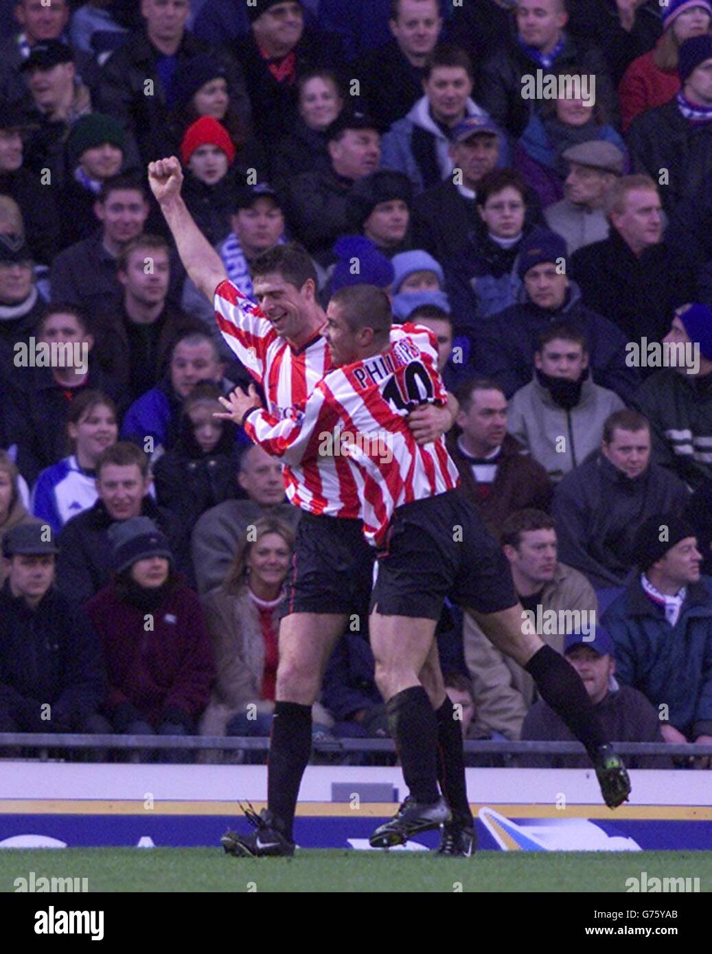 Sunderland's Niall Quinn (left) celebrates with team mate Kevin Phillips after their first goal