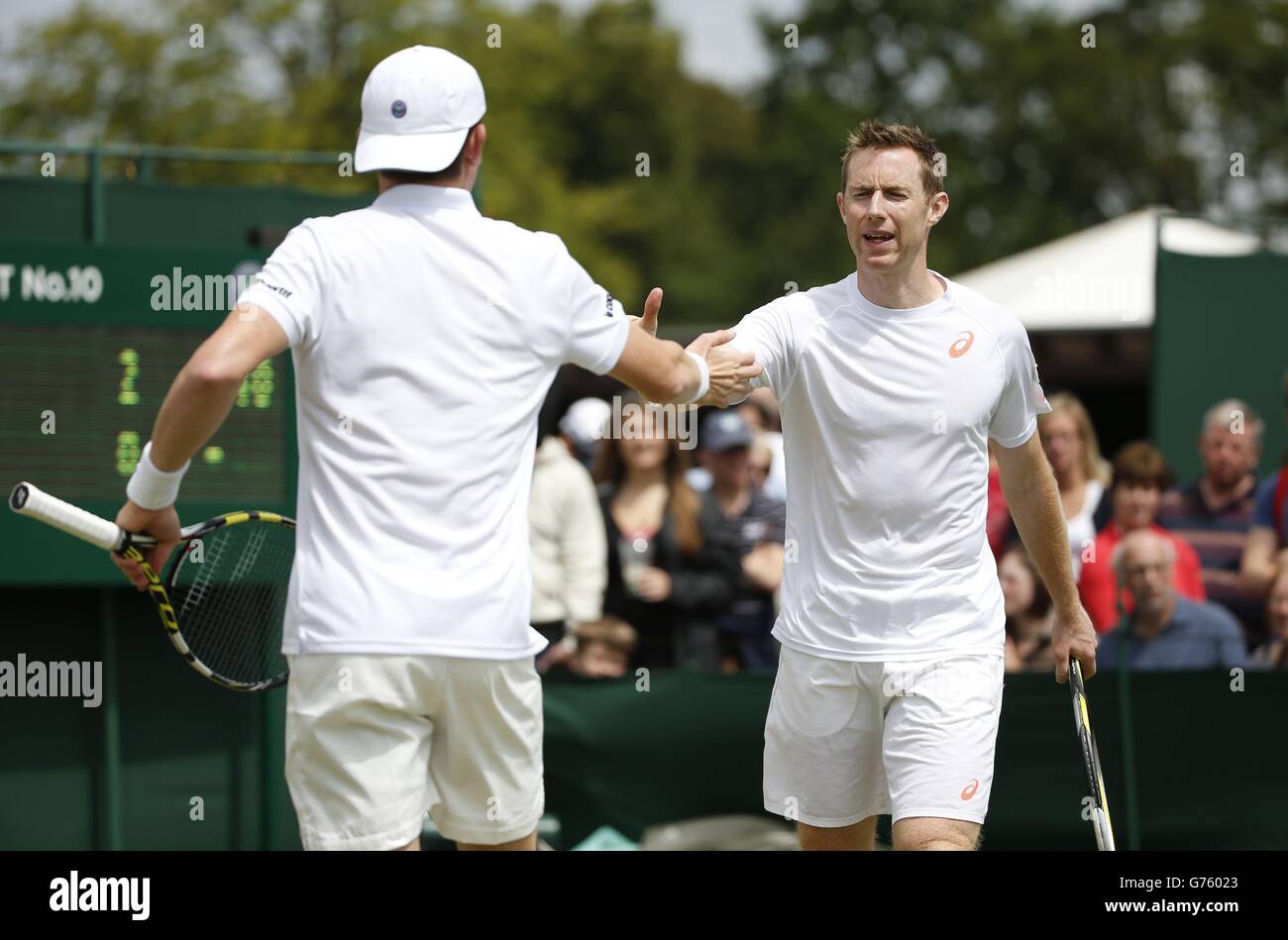 Great Britain's Jonathan Marray (right) and Australia's John-Patrick Smith  in their doubles match against Colombia's Juan-Sebastian Cabal and Poland's  Marcin Matowski during day five of the Wimbledon Championships at the All  England