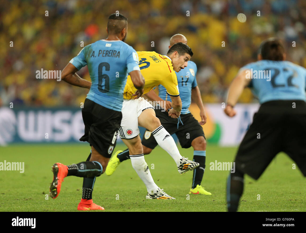 Colombia's James Rodriguez (centre) scores their first goal of the game during the FIFA World Cup, Round of 16 match at the Estadio do Maracana, Rio de Janeiro, Brazil. Stock Photo