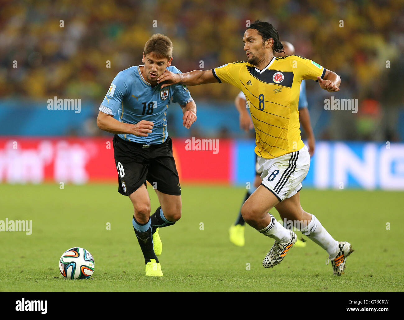 Colombia's Abel Aguilar (right) and Uruguay's Gaston Ramirez battle for the ball during the FIFA World Cup, Round of 16 match at the Estadio do Maracana, Rio de Janeiro, Brazil. Stock Photo