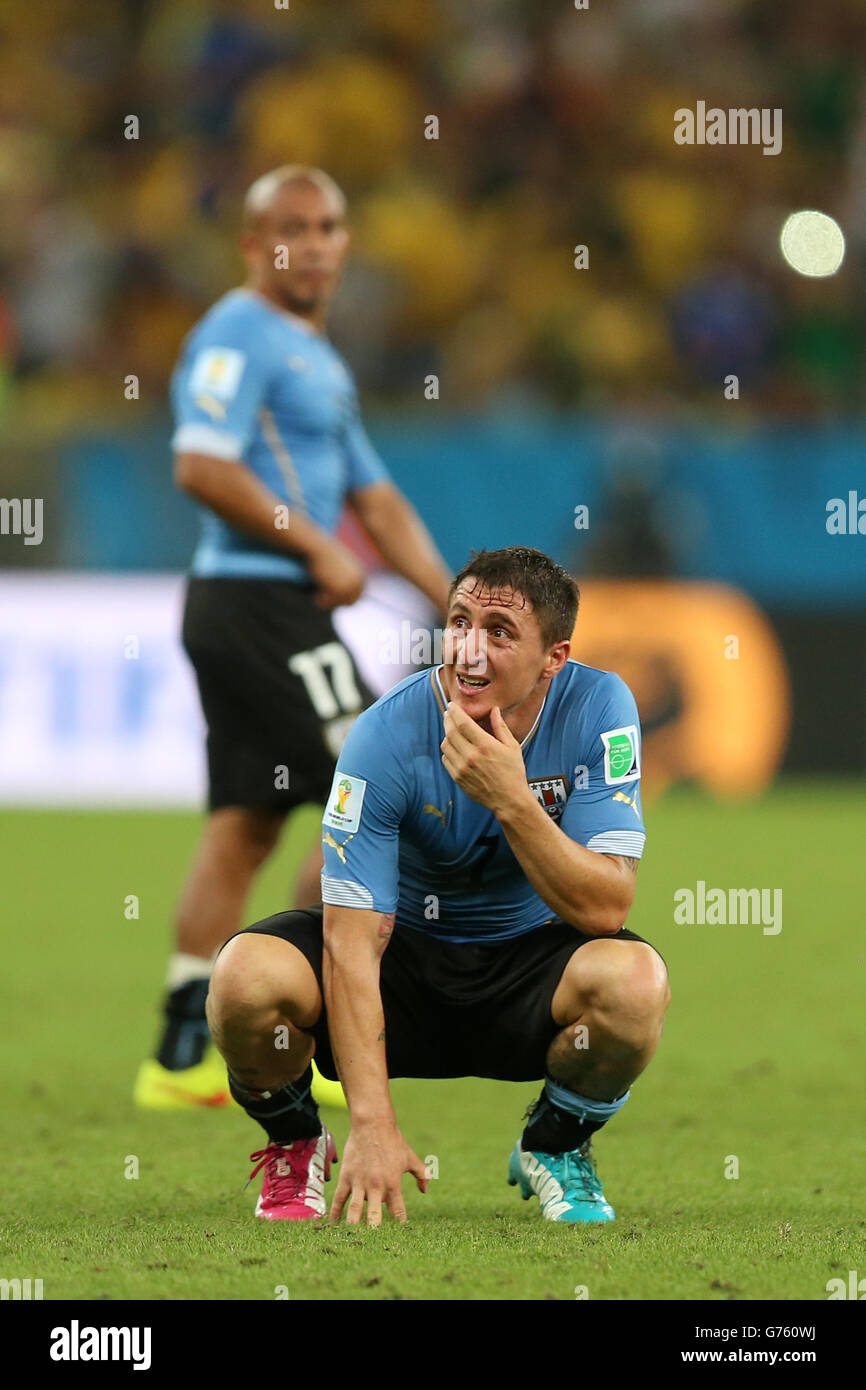 Uruguay's Cristian Rodriguez is left dejected after the final whistle in the FIFA World Cup, Round of 16 match at the Estadio do Maracana, Rio de Janeiro, Brazil. Stock Photo