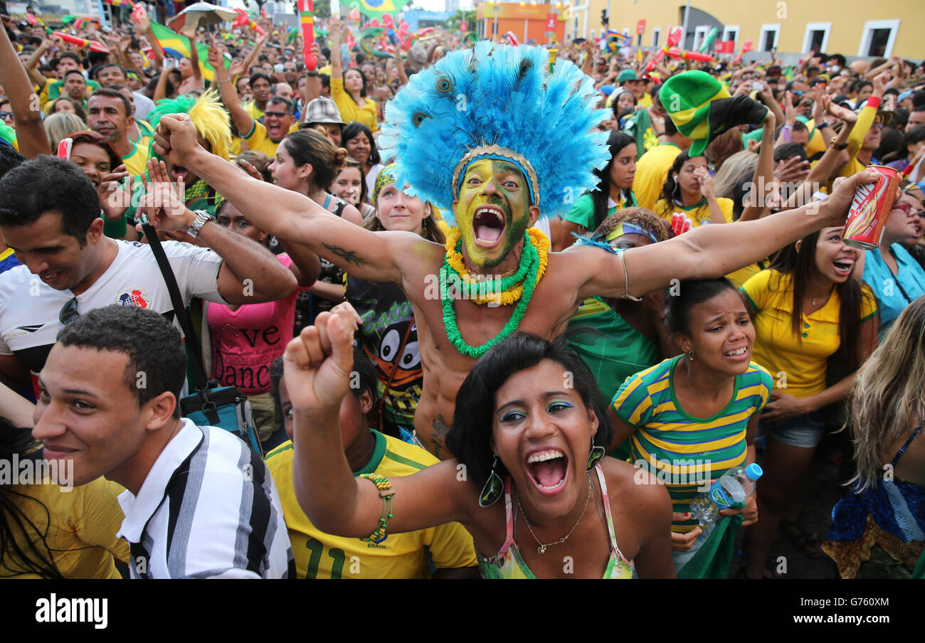 Brazil fans celebrate their team's victory in a penalty shoot-out over Chile as they watch in a fan park in Recife Stock Photo