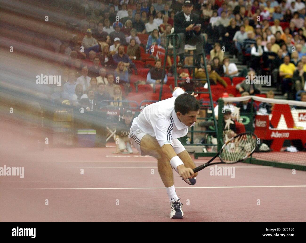 Great Britain's Tim Henman in action against Sweden's Jonas Bjorkman during the opening round of their Davis Cup World Group match at the National Indoor Arena, Birmingham. Stock Photo