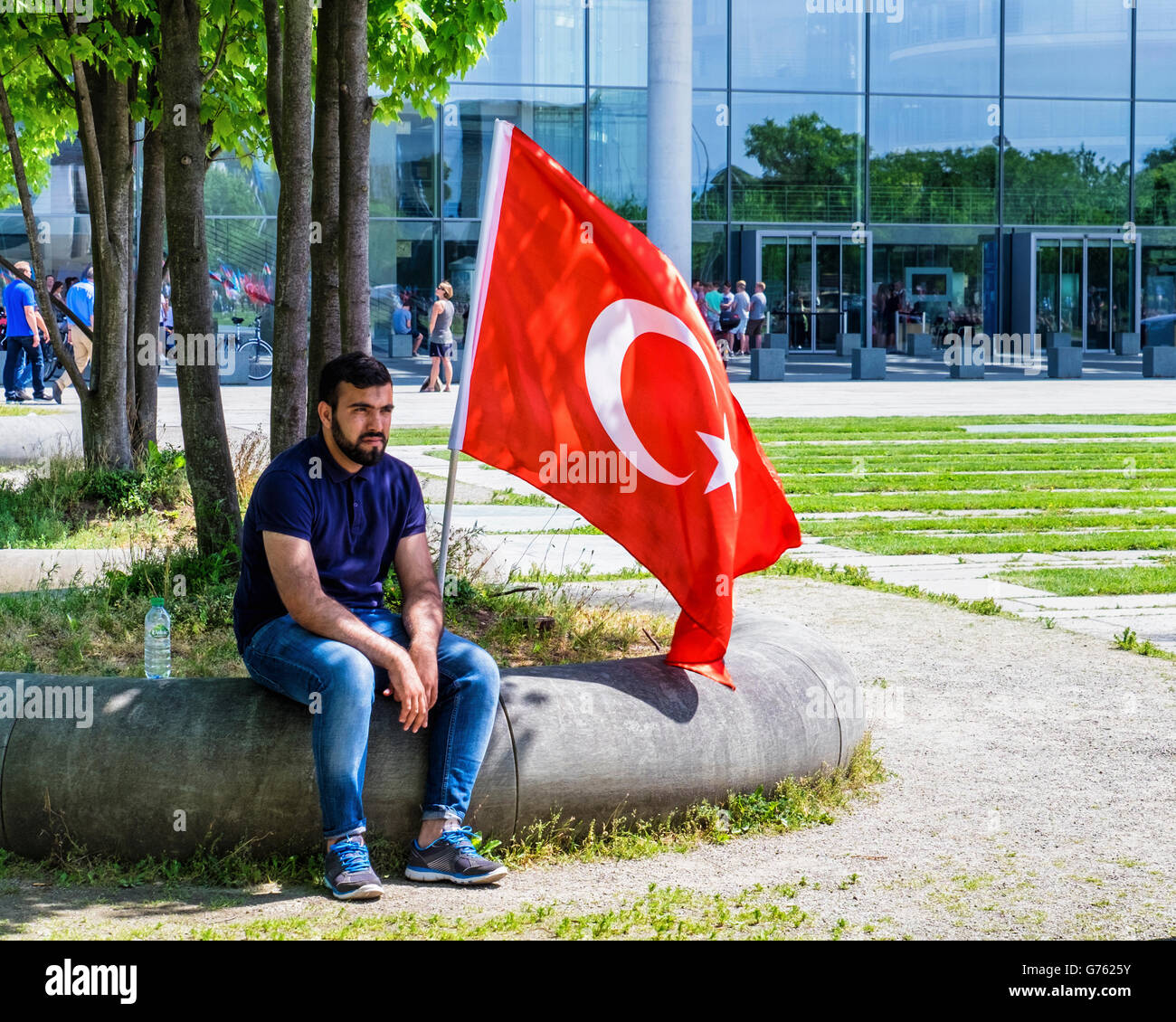 Turkish man with flag at rally near German Government Buildings, Berlin, Germany Stock Photo