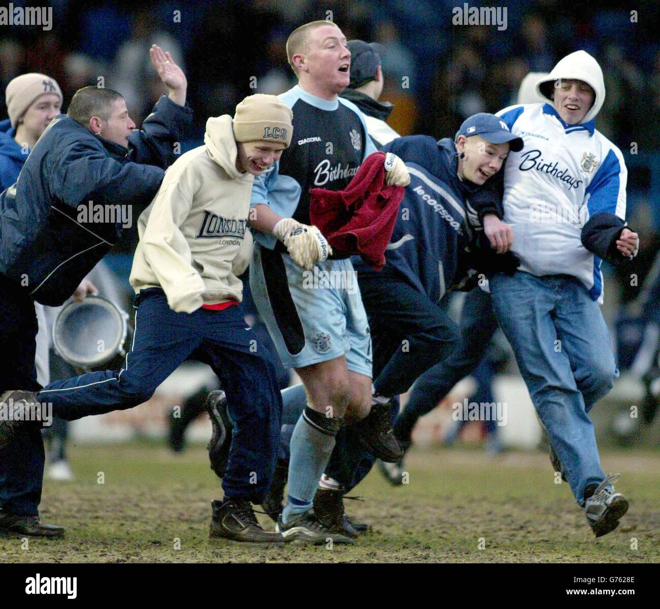 Bury's goalkeeper Paddy Kenny mobbed my fans in a pitch invasion after Bury's match with visitors Bournemouth in the Nationwide Division Two match at Bury's Gigg Lane ground. NO UNOFFICIAL CLUB WEBSITE USE. Stock Photo
