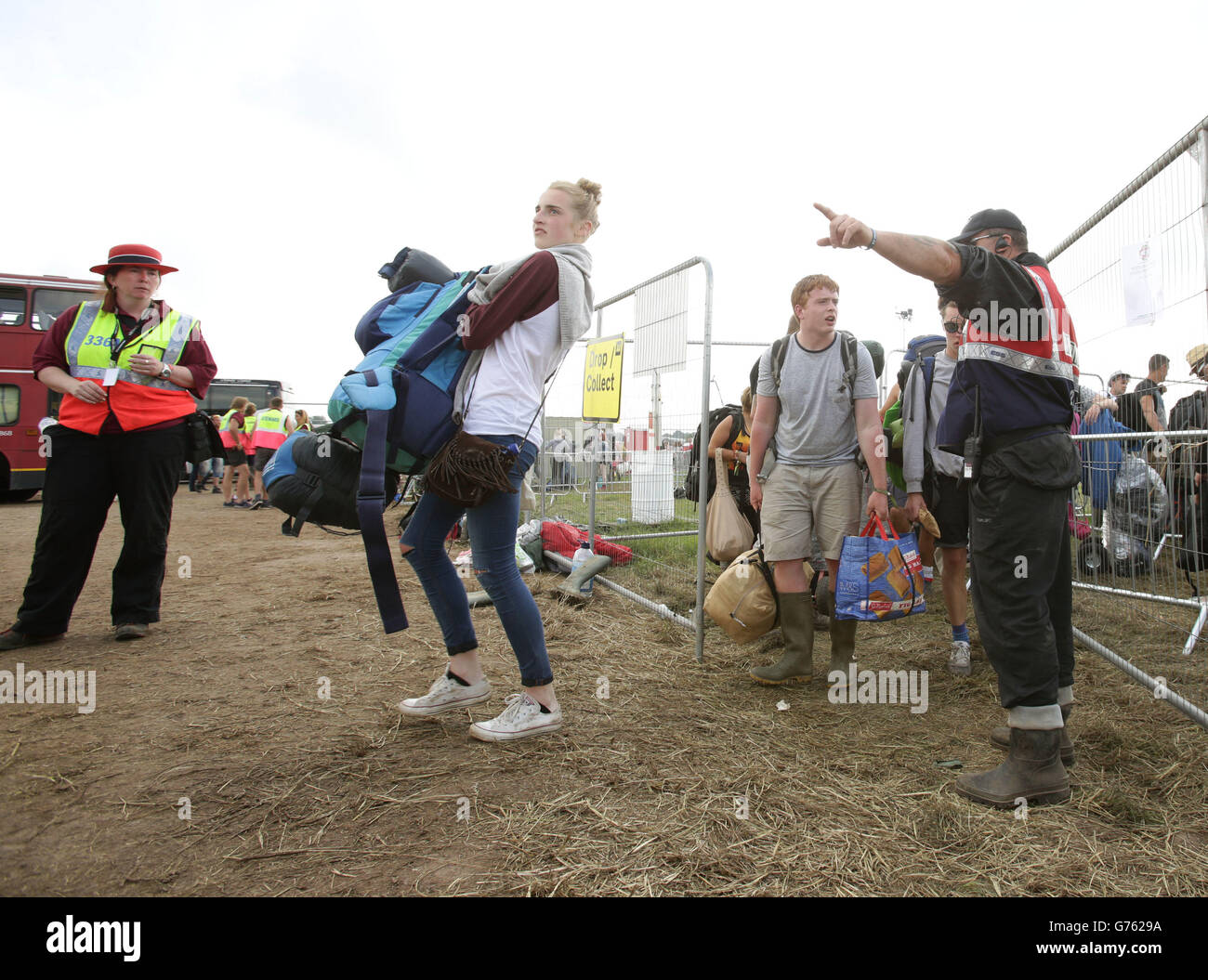 Festival goers at the bus station for transport leaving the Glastonbury  Festival, at Worthy Farm in Somerset Stock Photo - Alamy