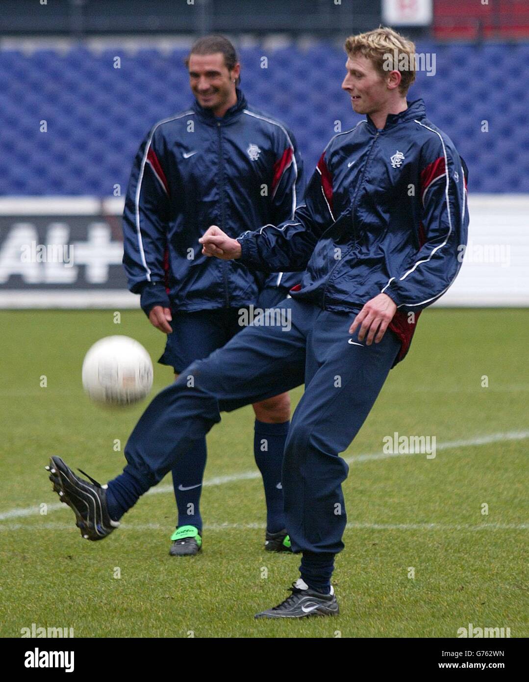 Rangers' Tore Andre Flo and Lorenzo Amoruso (left)) during a training session at Feyenoord Stadium before their UEFA cup clash with Feyenoord tomorrow. Stock Photo