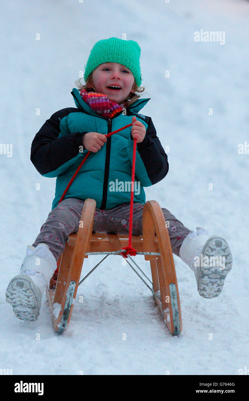 Girl with toboggan, tobogganing, Germany Stock Photo Alamy