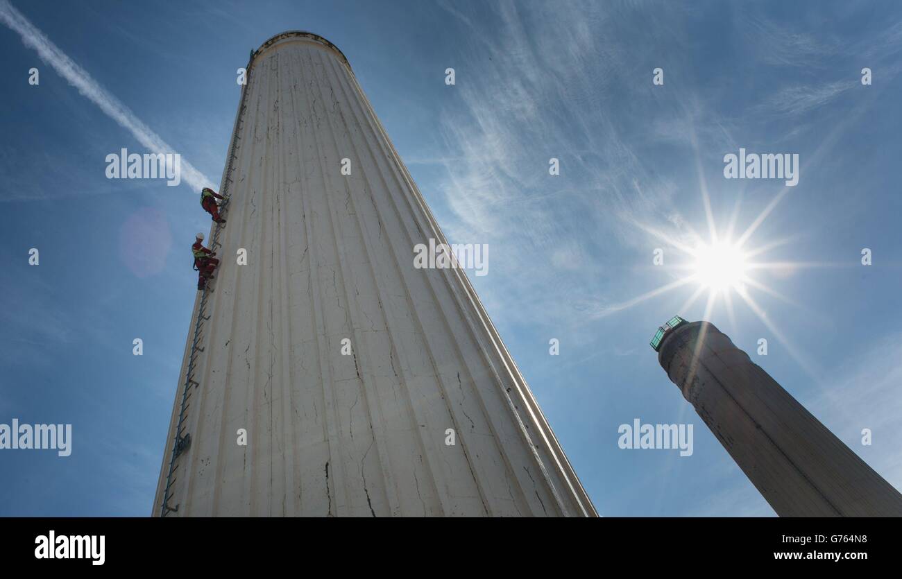 Steeple Jacks climb up the south west chimney of Battersea Power Station in south west London, where they are preparing to dismantle then rebuild the four chimneys as part of the redevelopment of the 1930s power station. Stock Photo