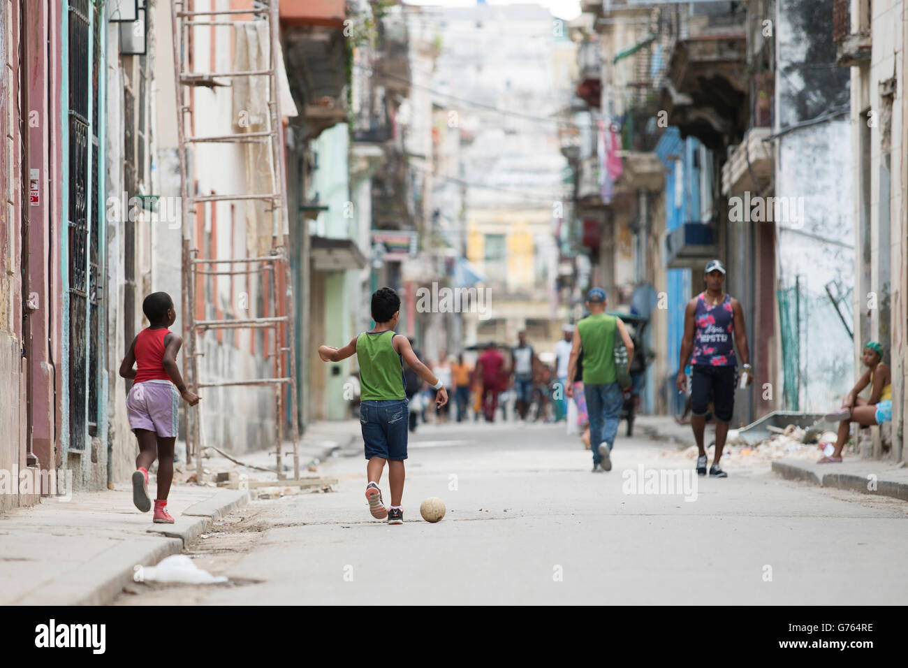 Young boys playing football in a street in Havana, Cuba Stock Photo