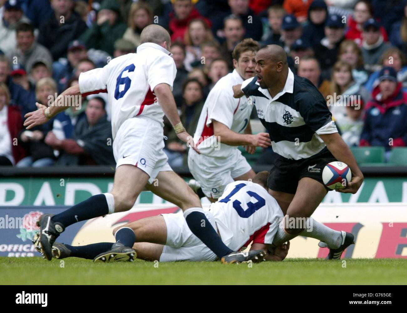 England v Barbarians. Barbarians' Jonah Lomu (right) is closed down by