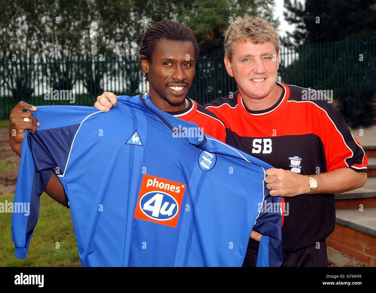 Birmingham City's new signing Aliou Cisse (left), the Senegal World Cup captain, with club manager Steve Bruce at the team's training ground. Stock Photo