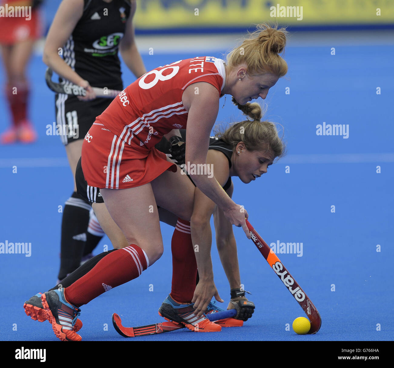 England's Nicola White is challenged by Wales' Alys Brooks during the London Cup at the Lee Valley Hockey and Tennis Centre, Queen Elizabeth Park, Stratford. Stock Photo
