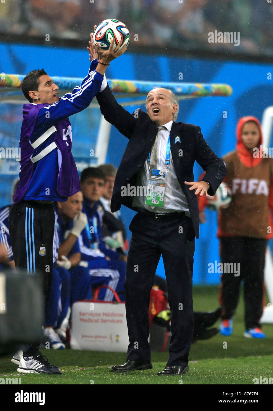 Soccer - FIFA World Cup 2014 - Semi Final - Netherlands v Argentina - Arena de Sao Paulo. Argentina manager Alenjandro Sabella grabs the ball out of the air on the touchline Stock Photo