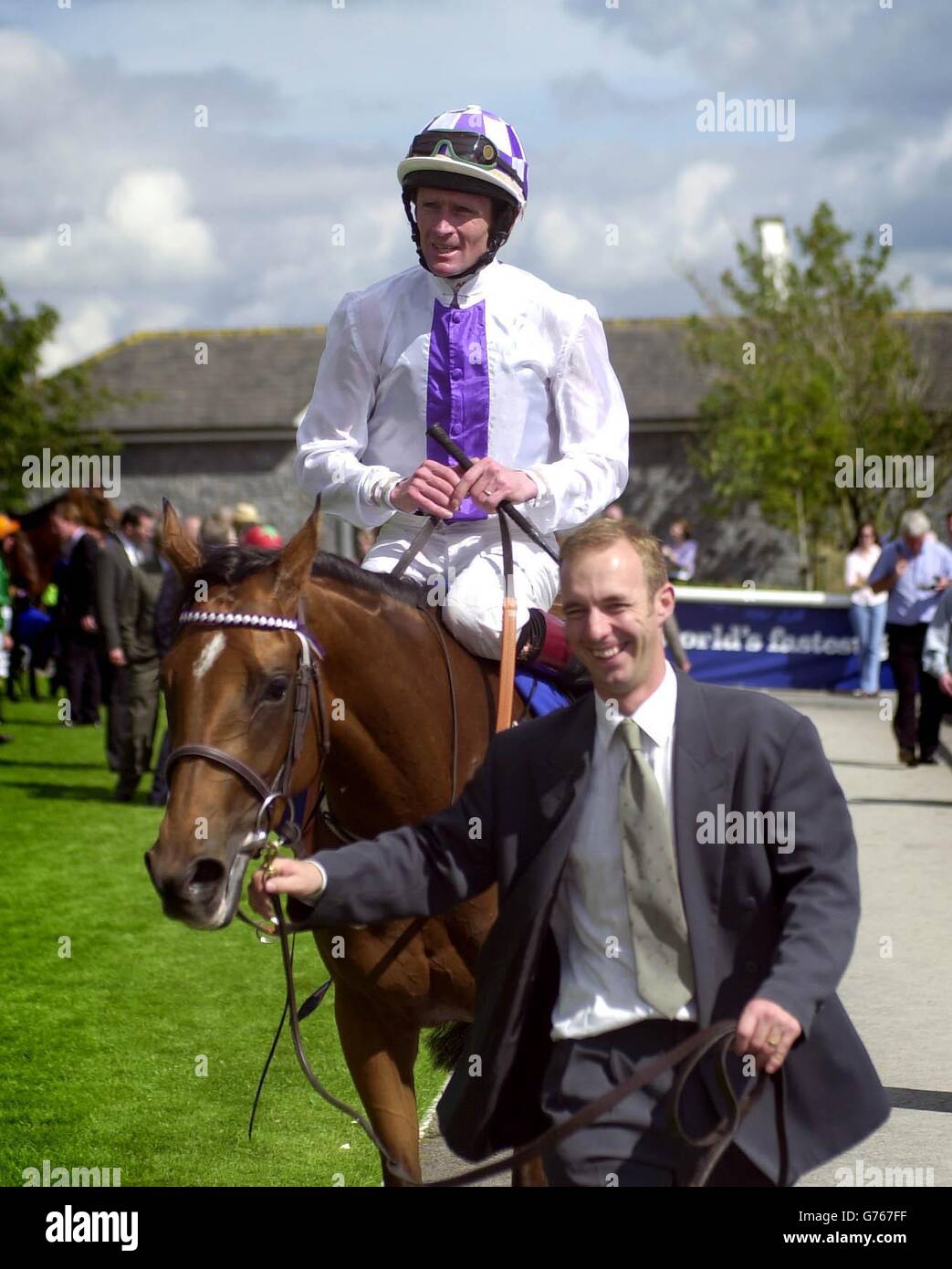 Margarula ridden by Kevin Manning is lead in to the winners enclosure after winning the Darley Irish Oaks from the favourite Quarter Moon at the Curragh, Ireland. Stock Photo
