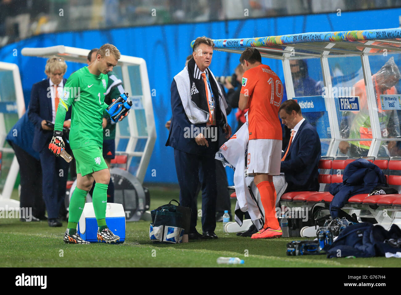 Netherlands manager Louis van Gaal looks to prepare to bring on Klaas Jan Huntelaar (right) as goalkeeper Jasper Cillessen appears to walk off the pitch, before the period of extra time begins during the FIFA World Cup Semi Final at the Arena de Sao Paulo, Sao Paulo, Brazil. Stock Photo