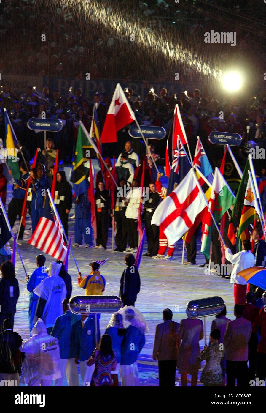 Flag bearers from countries of the Commonwealth stand together in the