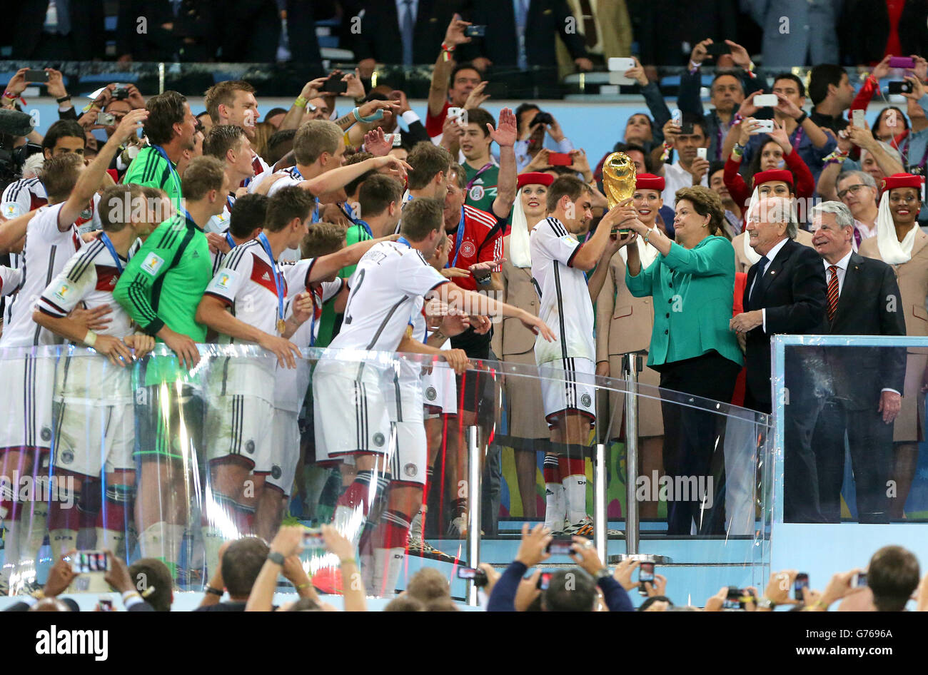 Soccer - FIFA World Cup 2014 - Final - Germany v Argentina - Estadio do Maracana. Germany's Philipp Lahm collects the FIFA World Cup trophy after the game Stock Photo
