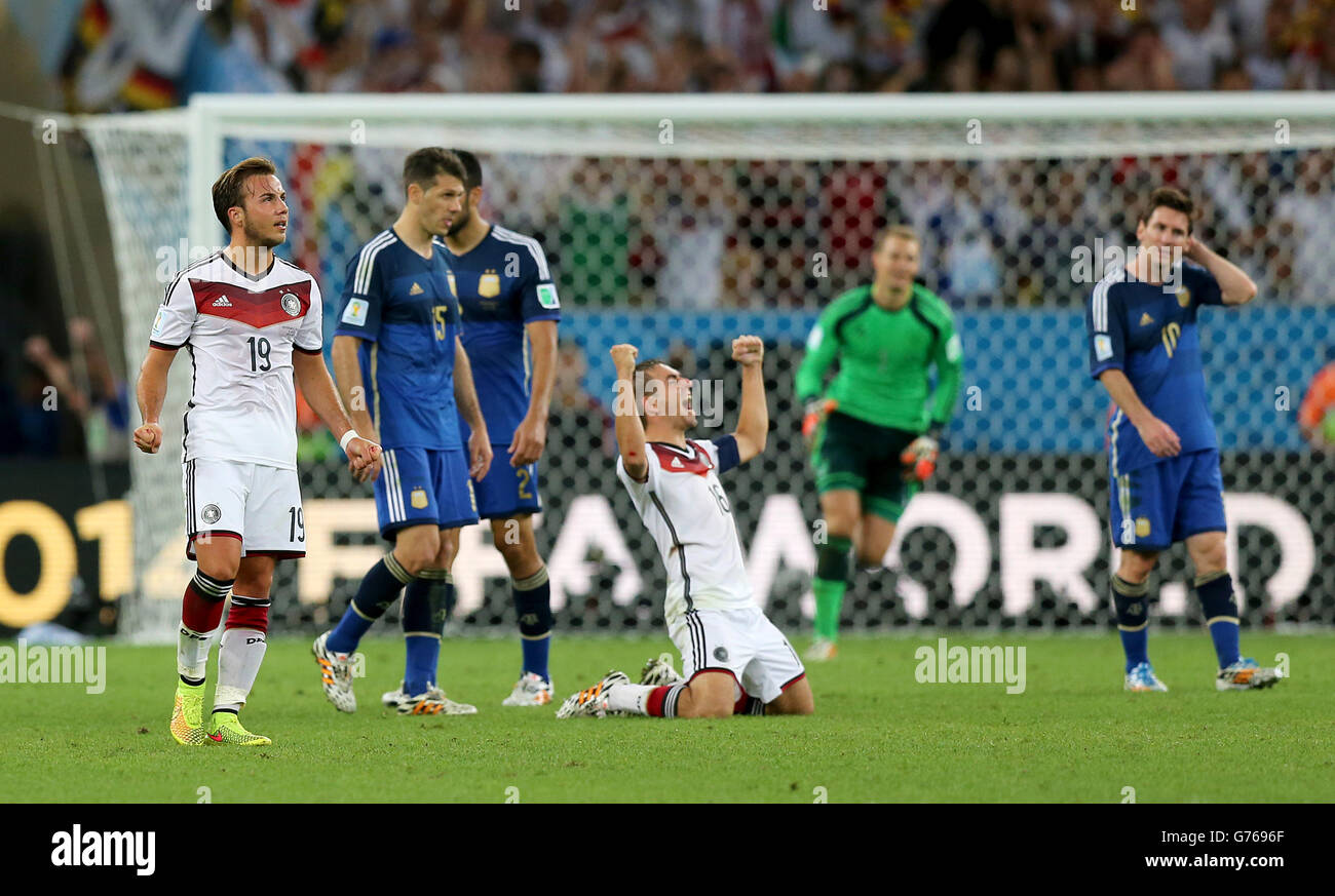 Soccer - FIFA World Cup 2014 - Final - Germany v Argentina - Estadio do Maracana. Germany's Philipp Lahm (centre) and Mario Gotze celebrate the win after the final whistle. Stock Photo