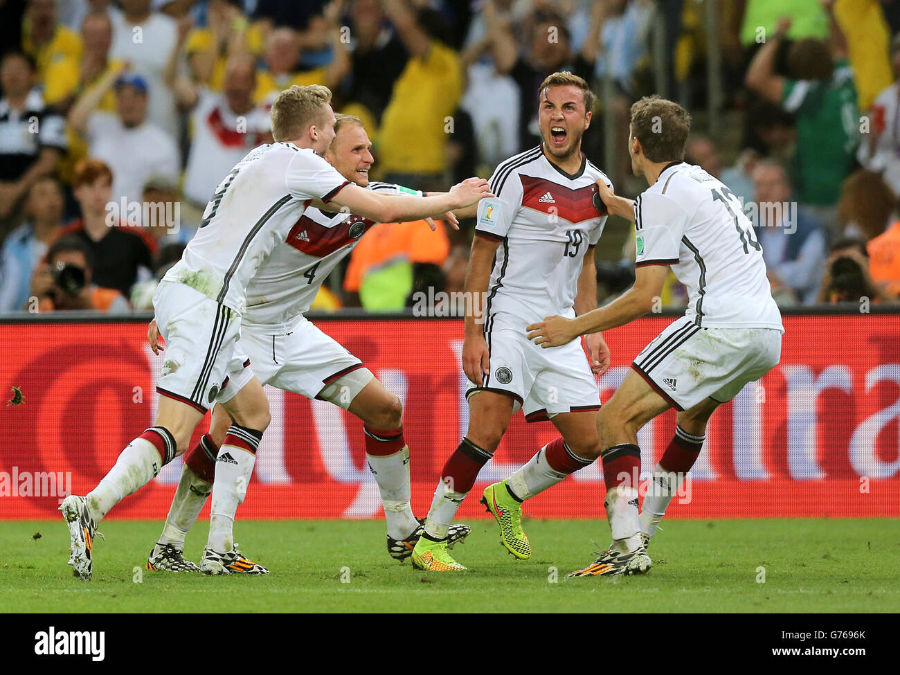 Germany's Mario Gotze (centre) celebrates with his team-mates after scoring the winning goal in extra-time Stock Photo