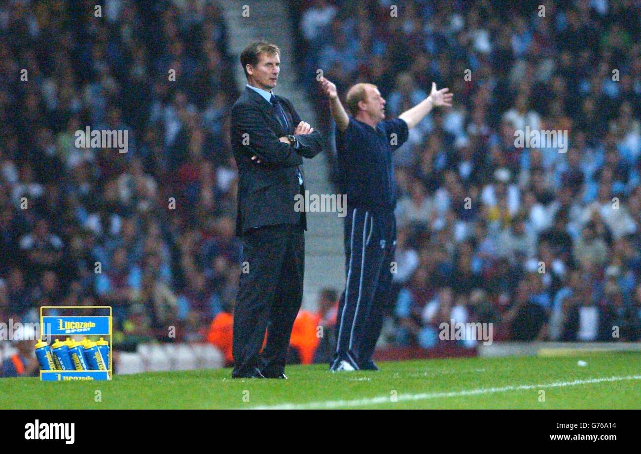 West Ham manager Glenn Roeder (left) is shadowed by a happy Gary Megson after his team West Brom won 1-0, during their Barclaycard Premiership match at Upton Park, London. Stock Photo