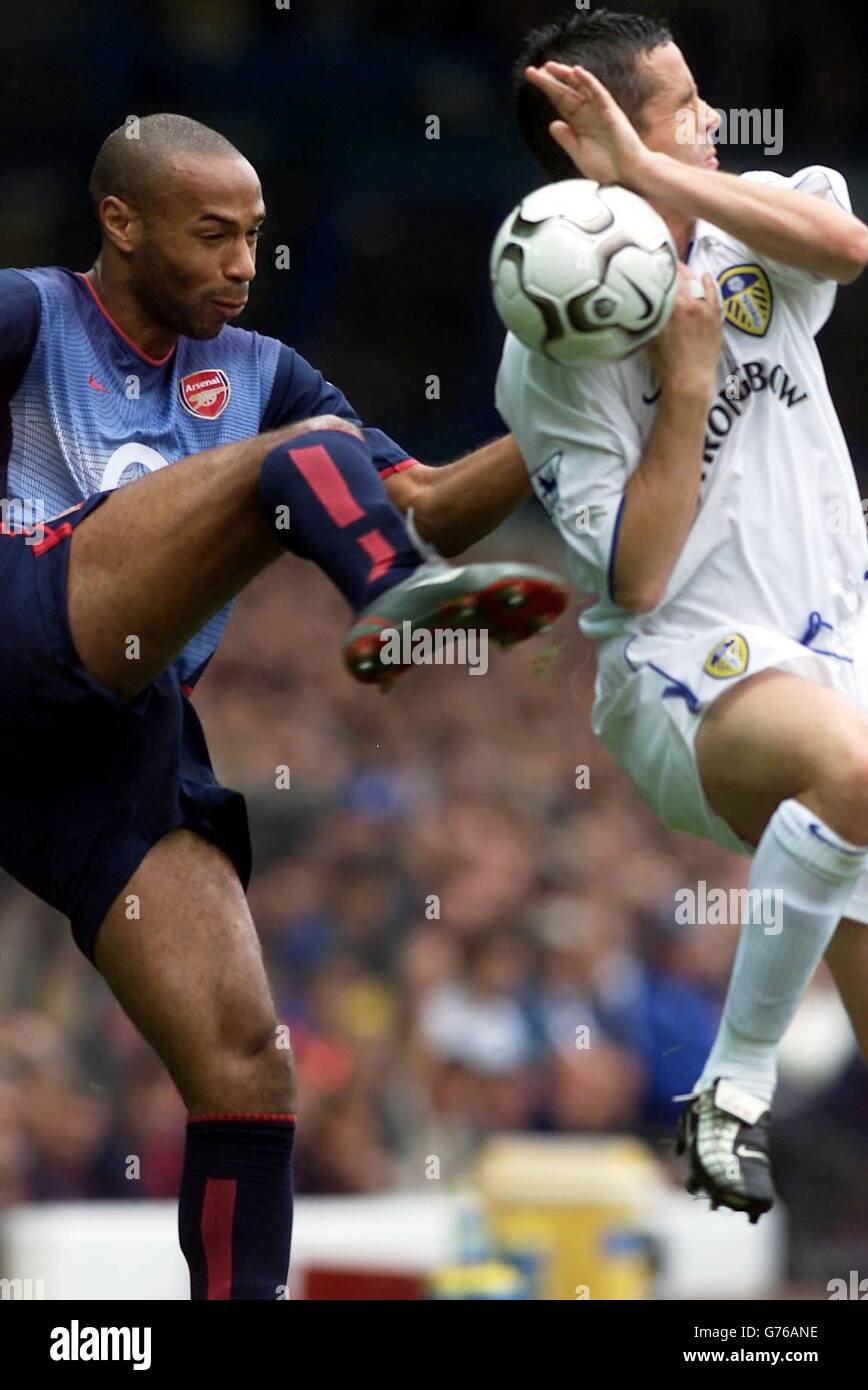 Arsenal's Thierry Henry in action against Leeds United's Gary Kelly (right) during their FA Barclaycard Premiership match at Leeds' Elland Road ground, Yorkshire. Arsenal defeated Leeds United 4-1. Stock Photo
