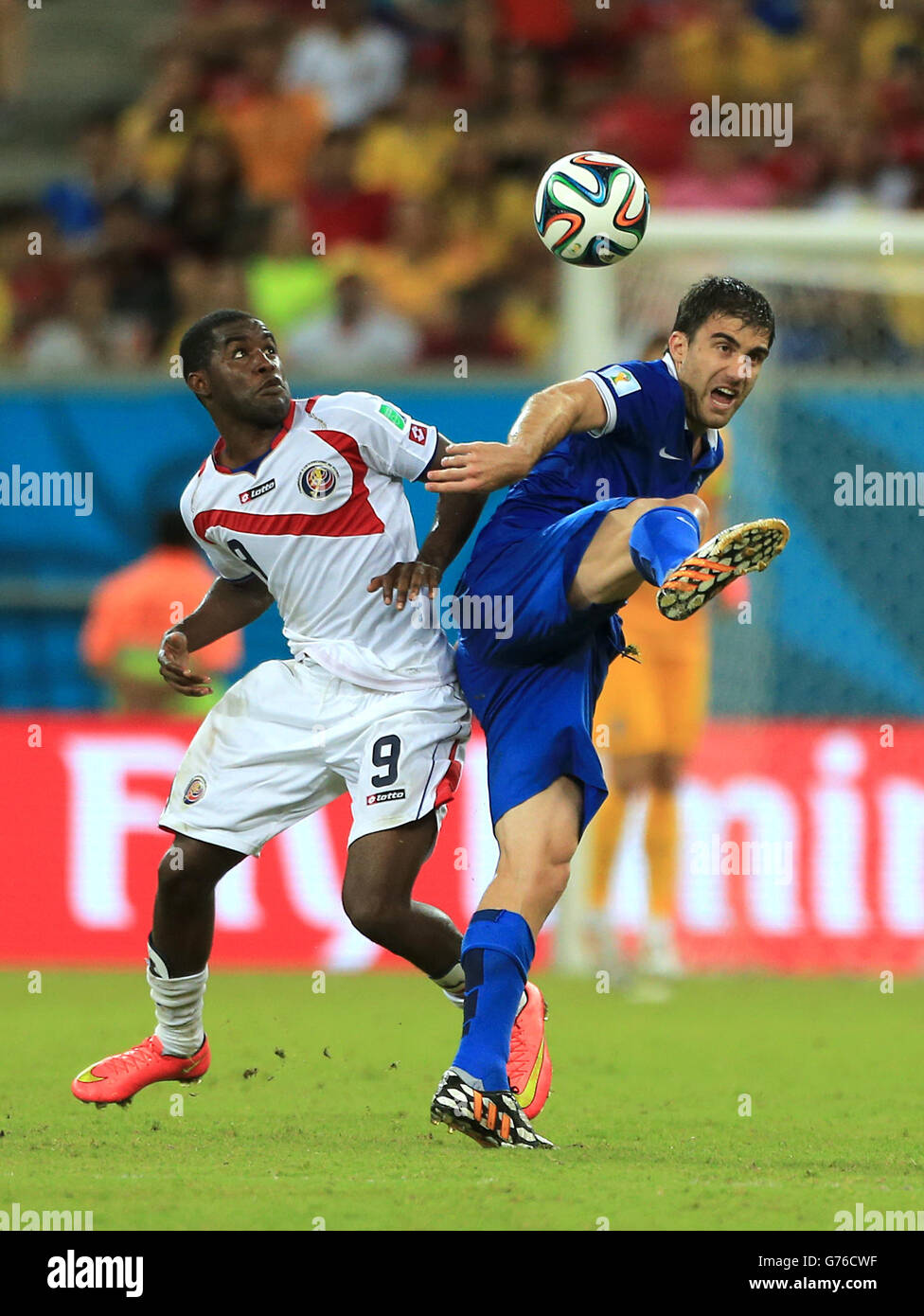 Costa Rica's Joel Campbell and Greece's Sokratis Papastathopoulos (right) battle for the ball Stock Photo