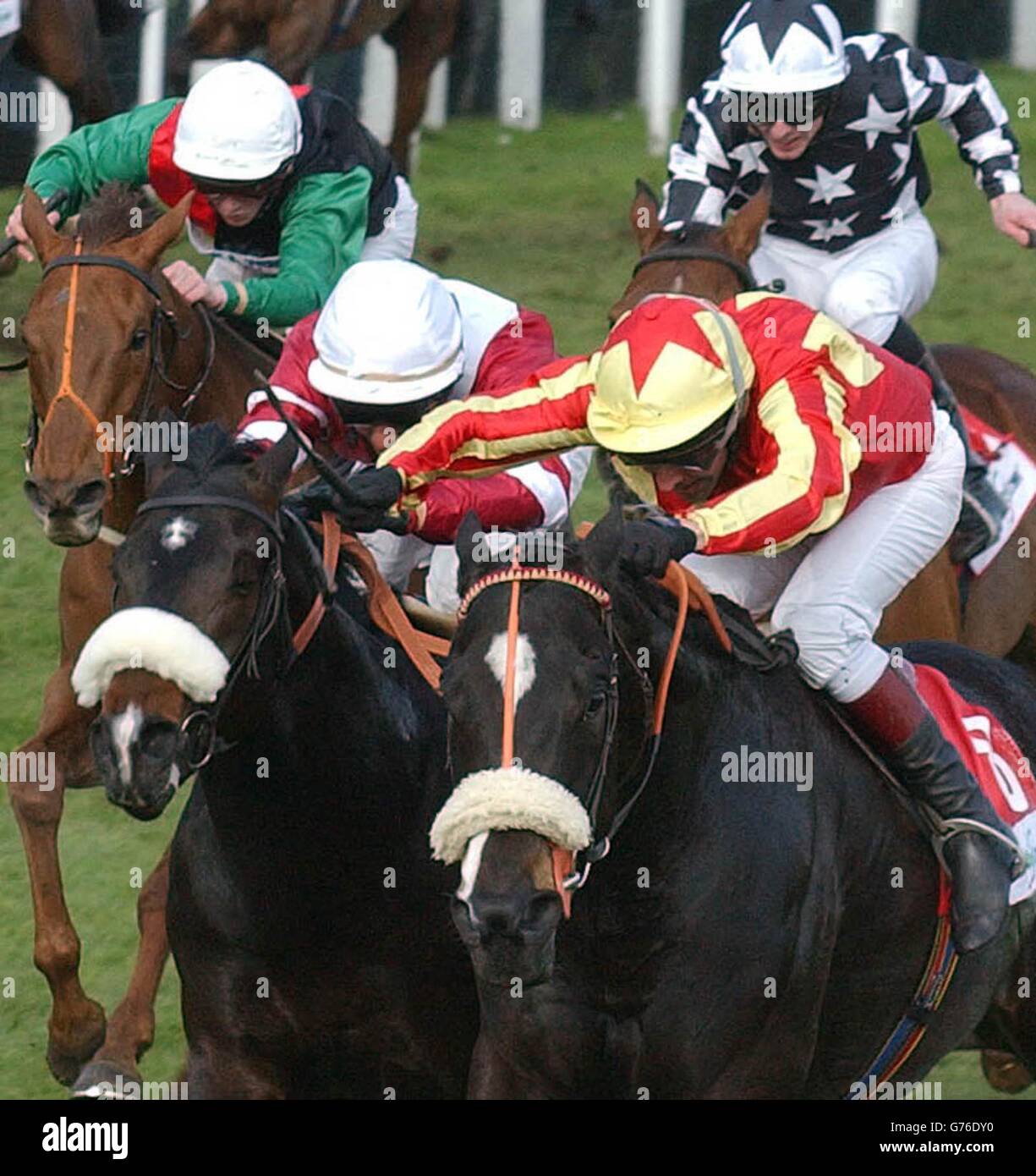 Zucchero ridden by Simon Whitworth (R) wins the Randombet.Com Lincoln Handicap from Adiemus ridden by Royston Ffrench at Doncaster Races. Stock Photo