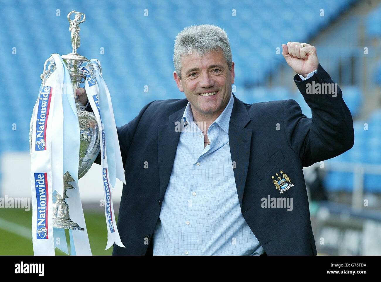 Manchester City manager Kevin Keegan holds the Nationwide Division One trophy aloft after his side's 3-1 victoory against Portsmoouth at Maine Road, Manchester. NO UNOFFICIAL CLUB WEBSITE USE. Stock Photo