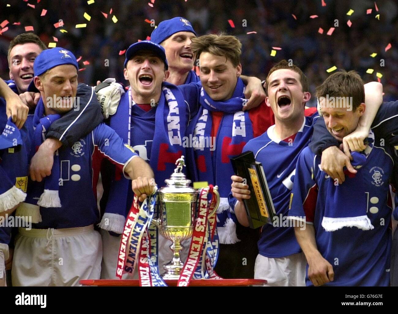 Ranger's (left to right) Allan McGregor, Ronald de Boer, Shota Arveladze, Tore Andre Flo, Stefan Klos, Barry Ferguson, Neil McCann celebrate winning the Tennent's Scottish Cup final match between Celtic and Rangers at Hampden Park, Glasgow Rangers defeated Celtic 3-2. *12/05/02Ranger's (left to right) Allan McGregor, Ronald de Boer, Shota Arveladze, Tore Andre Flo, Stefan Klos, Barry Ferguson, Neil McCann celebrate winning the Tennent's Scottish Cup final match between Celtic and Rangers at Hampden Park, Glasgow Rangers defeated Celtic 3-2. Celtic and Rangers will be invited to join the Stock Photo