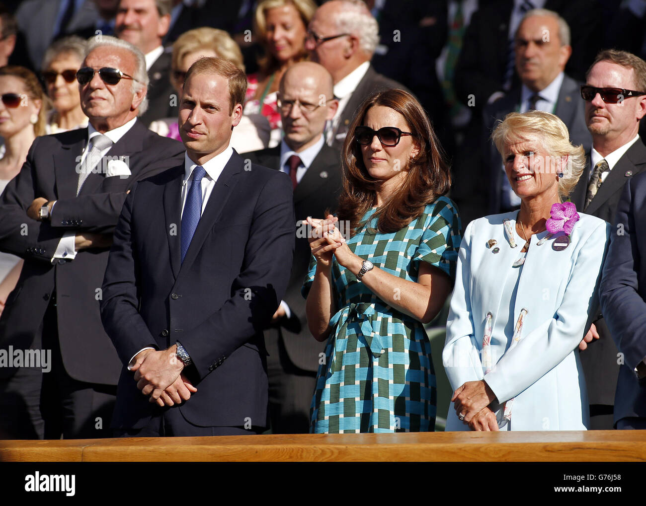 The Duke and Duchess or Cambridge applaud Serbia's Novak Djokovic and Switzerland's Roger Federer after watching the mens singles final during day fourteen of the Wimbledon Championships at the All England Lawn Tennis and Croquet Club, Wimbledon. Stock Photo