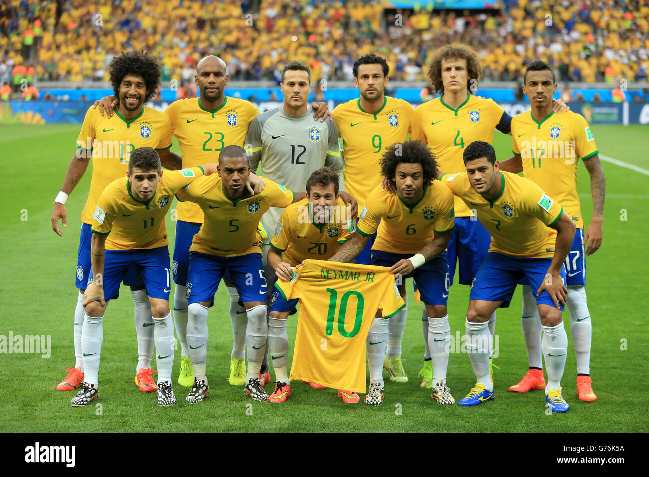 Brazil team group (top row left to right) Dante, Maicon, Julio Cesar, Fred, David Luiz and Luiz Gustavo. (bottom row left to right) Brazil's Oscar, Fernandinho, Bernard, Marcelo and Hulk holding the shirt of injured teammate Neymar before the FIFA World Cup Semi Final at Estadio Mineirao, Belo Horizonte, Brazil. Stock Photo