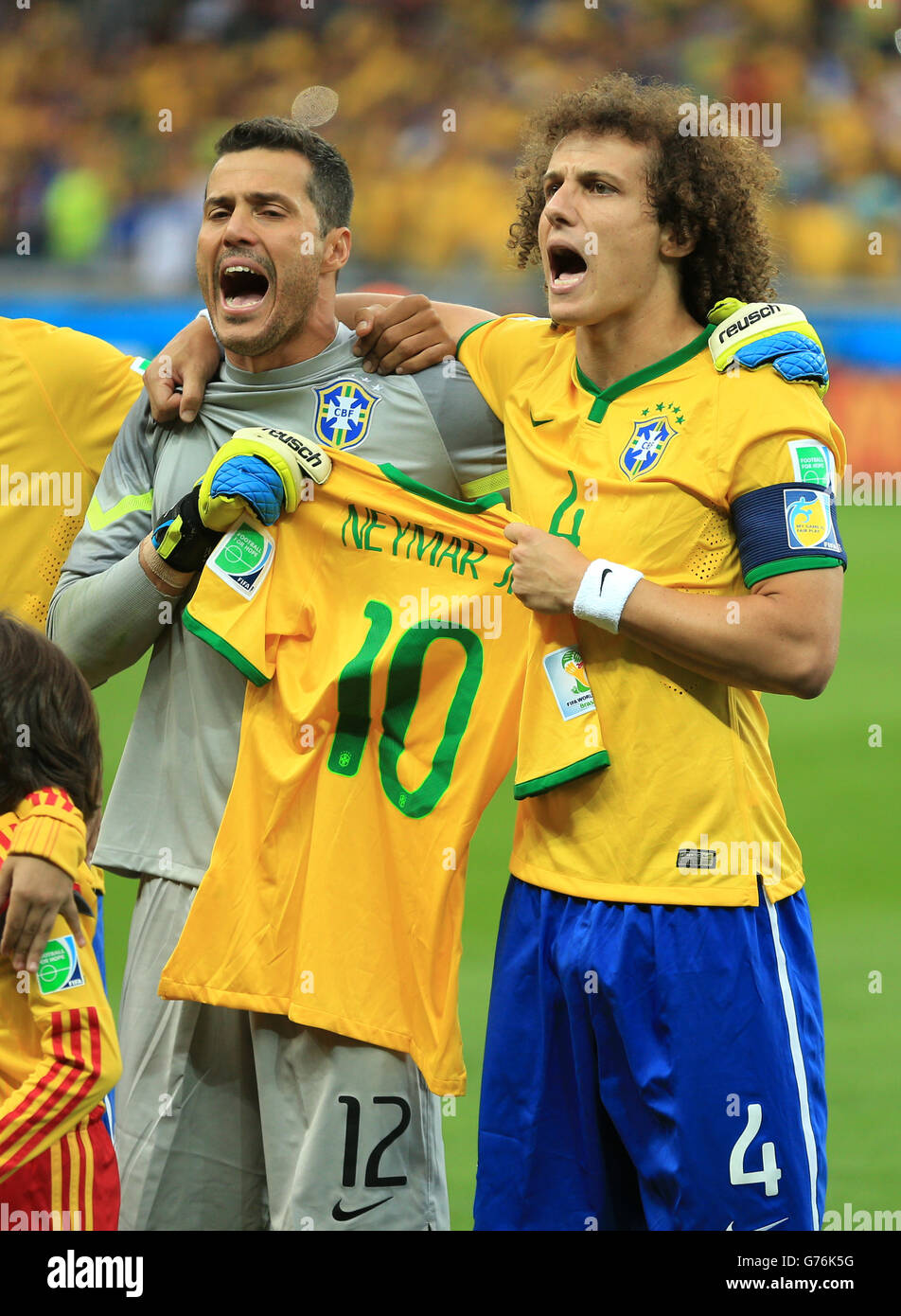Brazil goalkeeper Julio Cesar and Brazil's David Luiz (right) hold up the shirt of injured teammate Neymar during the anthems before the FIFA World Cup Semi Final at Estadio Mineirao, Belo Horizonte, Brazil. Stock Photo