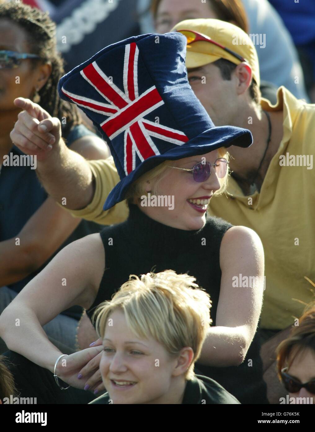 Tennis fans watch Britain's number one men's tennis star Tim Henman in