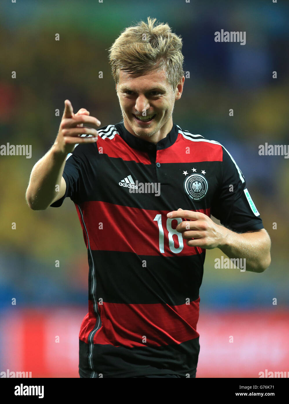 Germany's Toni Kroos celebrates scoring his side's third goal of the game during the FIFA World Cup Semi Final at Estadio Mineirao, Belo Horizonte, Brazil. Stock Photo