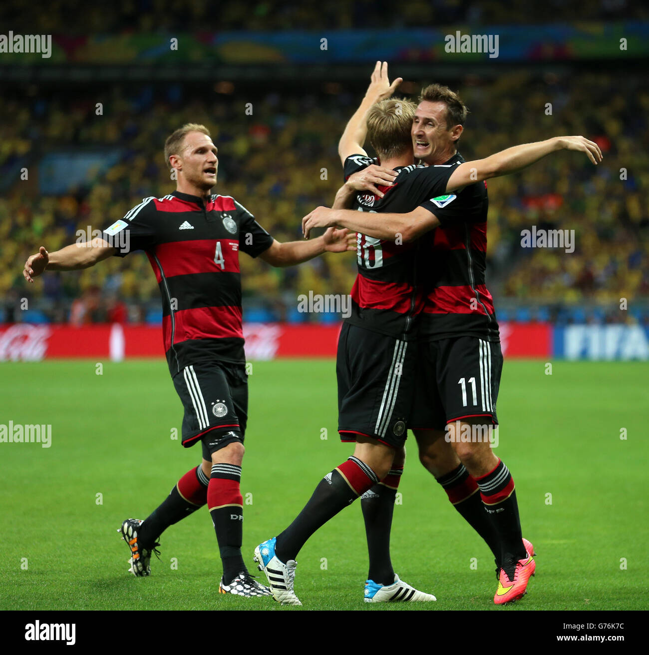 Germany's Toni Kroos celebrates scoring his side's third goal of the game with teammate Germany's Miroslav Klose (right) during the FIFA World Cup Semi Final at Estadio Mineirao, Belo Horizonte, Brazil. Stock Photo