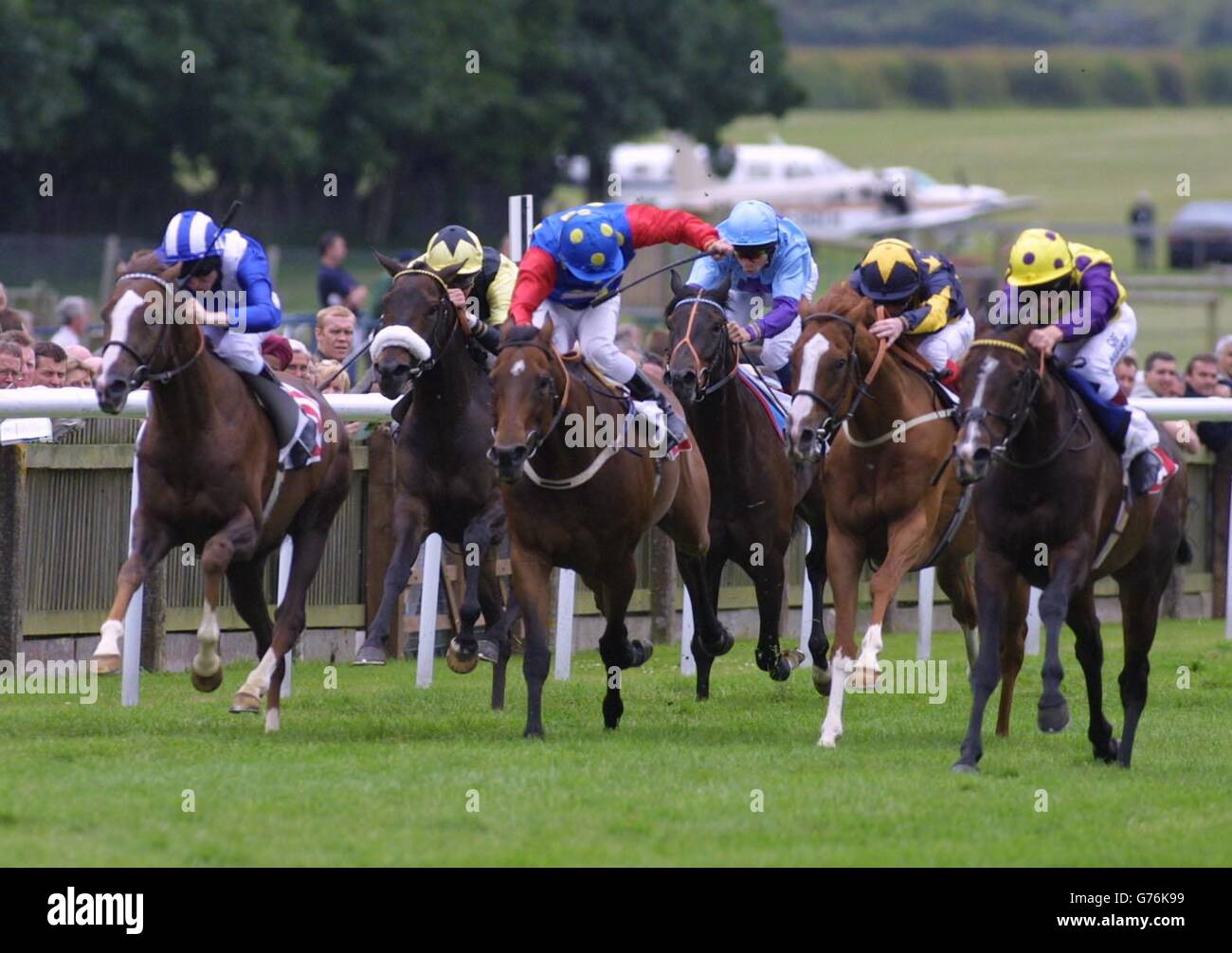 Eastern Breeze ridden by Richard Quinn (R). Eastern Breeze ridden by Richard Quinn (right) wins the Group Rated Stakes Class C Handicap at Newmarket. Stock Photo