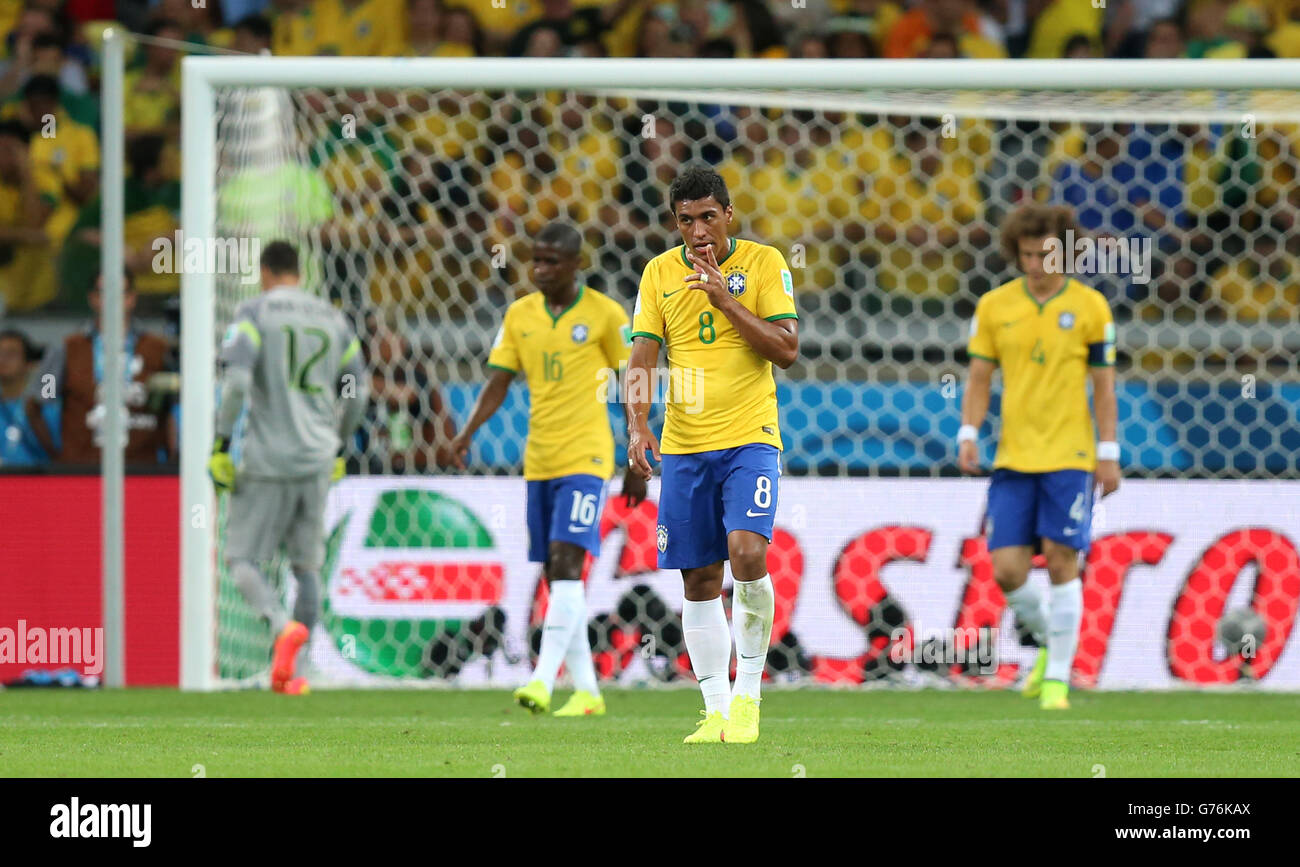 (left to right) Brazil's Julio Cesar, Ramires, Paulinho and David Luis dejected after Germany score their sixth goal during the FIFA World Cup Semi Final at Estadio Mineirao, Belo Horizonte, Brazil. Stock Photo